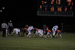 CHECK THAT SCORE BOARD As Ladue’s defensive line matches up against long time rival Clayton, the players prepare to rush the quarterback. The Rams emerged victorious, earning a 46-21 thrashing of the hated Greyhounds. The win boosted Ladue’s record to 6-3.