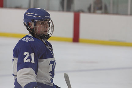 Junior Jake Gould waits for the puck before the face-off. Gould scored one goal in Ladue's 8-2 victory over Whitfield. 