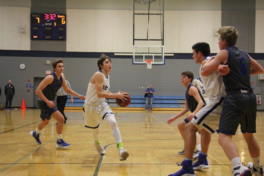 Sophomore Bryce Bussard drives to the basket against Westminster.