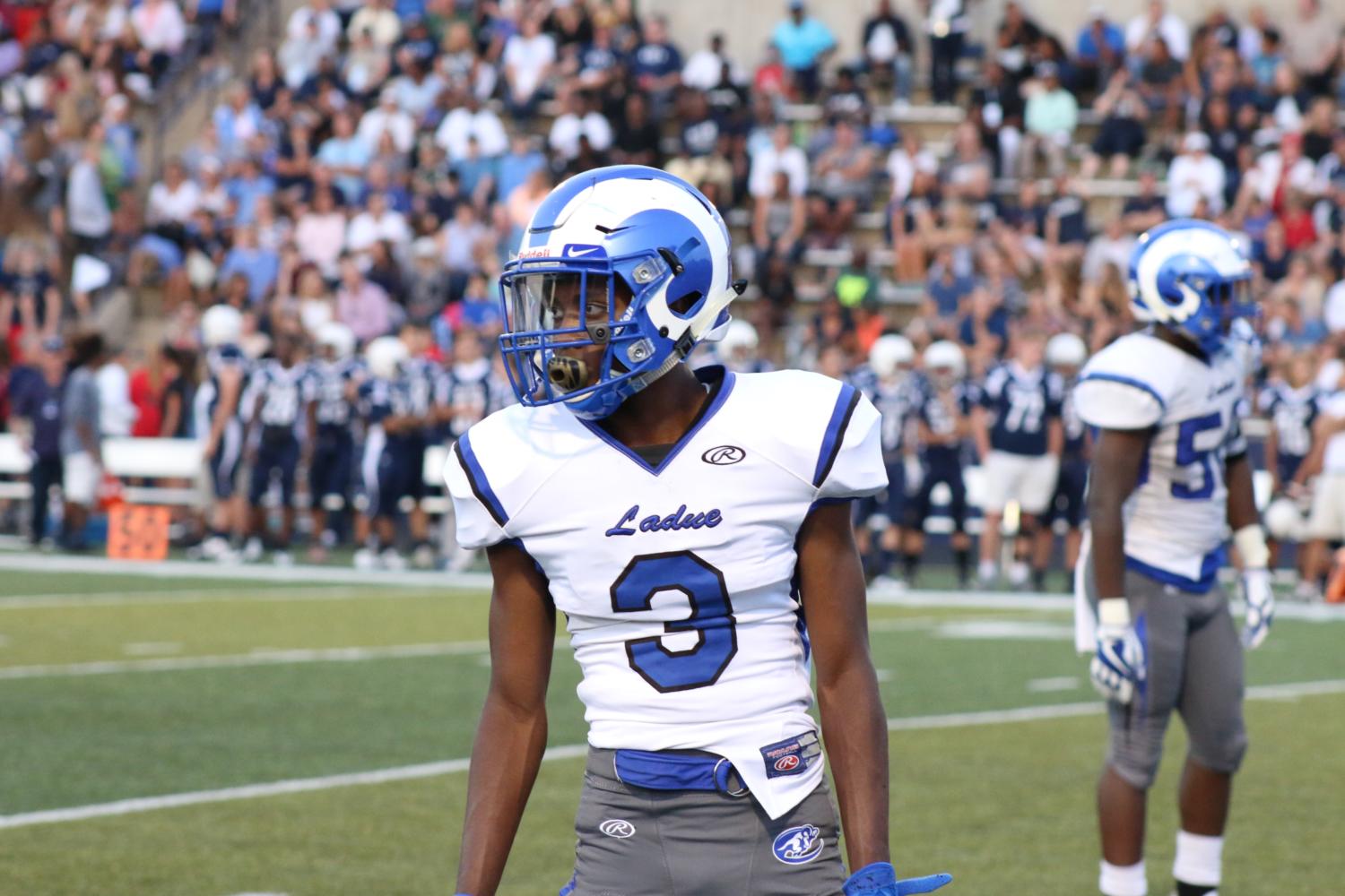 Senior Demonn Martin looks to the sideline for the play call. 