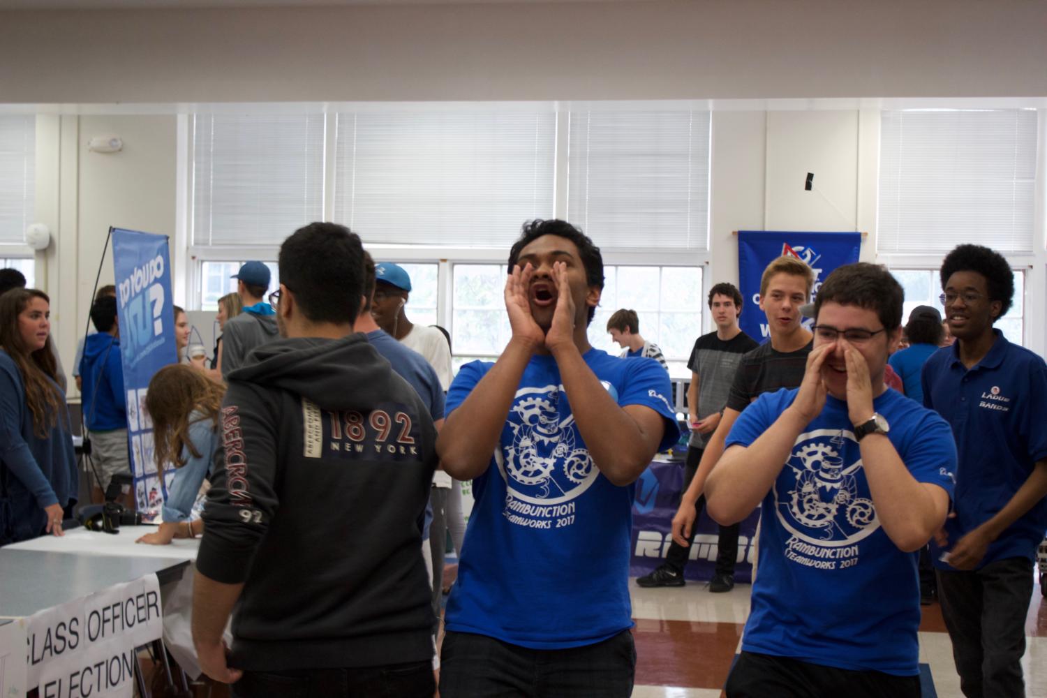 Senior Abhay Cashikar and Joel Willick hope to get students to sign up for robotics. 