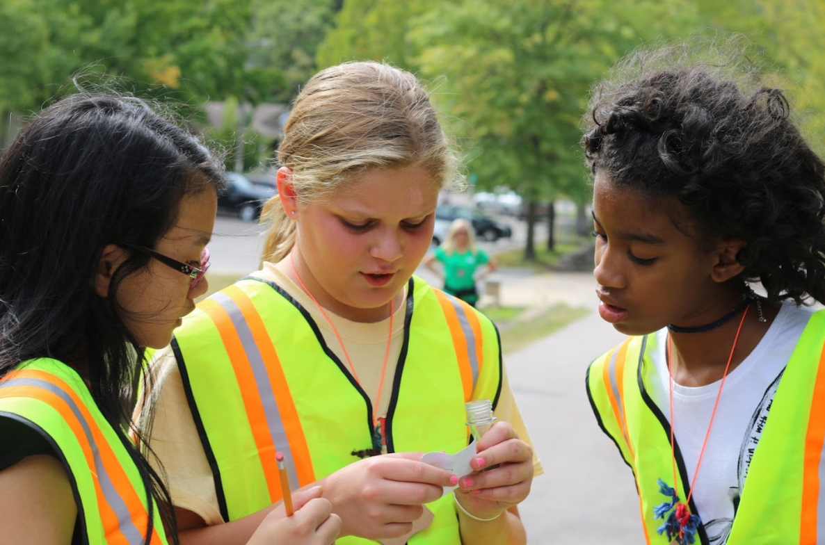 A group of sixth graders go geocaching during first session of Sixth Grade Camp. 