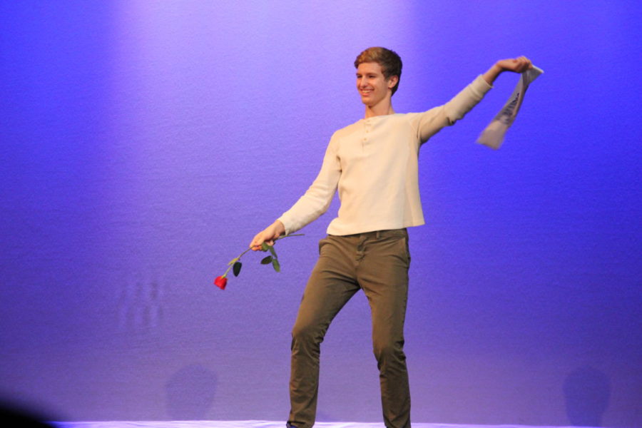 Habitat for Humanity hosted their seventh annual "Mr. Ladue" contest on March 13th. Senior Reid Rogers takes off his sash as he dances.