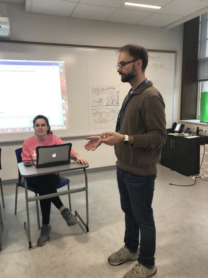 Mr. Miller instructs his students during a Mock Trial meeting
