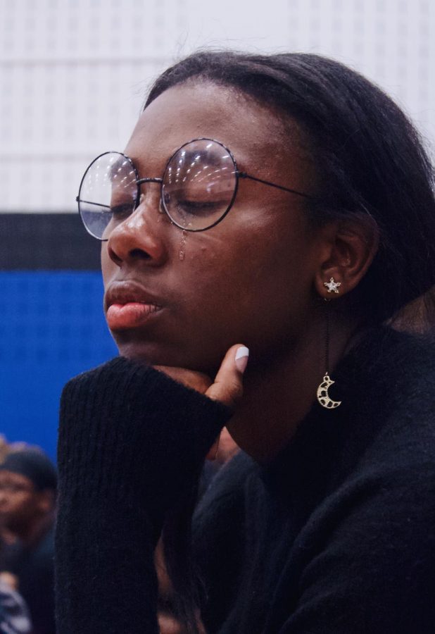 Tears streaming down her face, Senior Carrie Washington witnesses the emotional process of naturalization. 