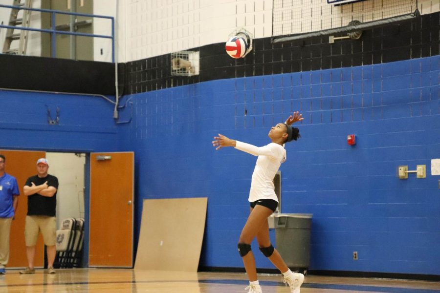 Senior Kyndia Smith serves the ball. 