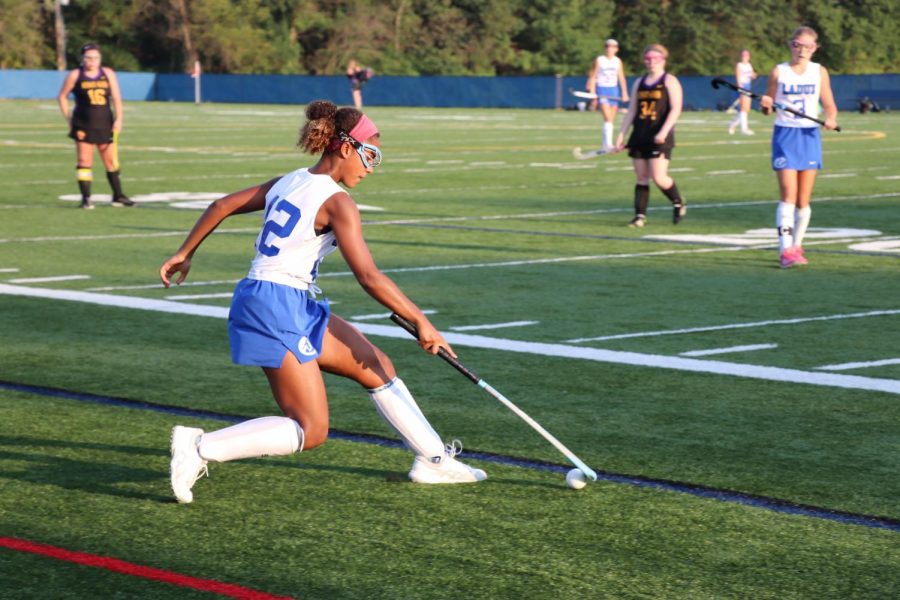Taylor Babb (9) stops the ball from going out of bounds. 