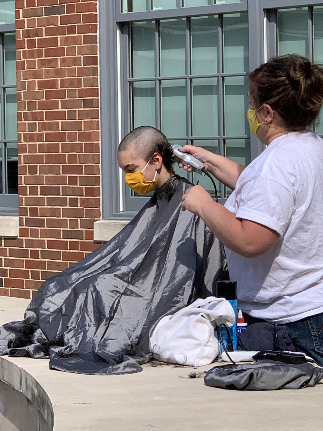 Just a Little Off the Top: Dougan Shaves Head in his Sister's Honor