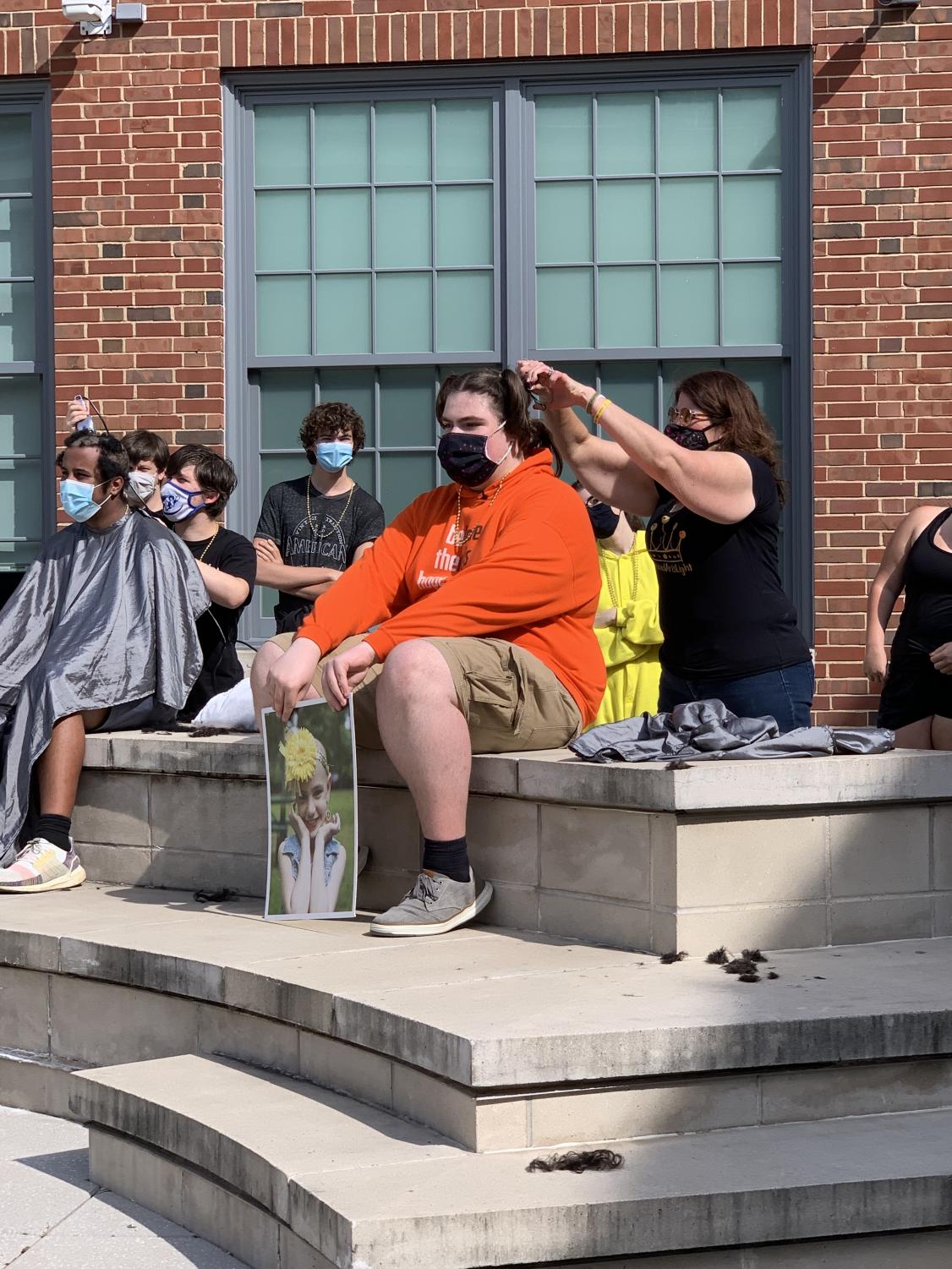 Just a Little Off the Top: Dougan Shaves Head in his Sister's Honor