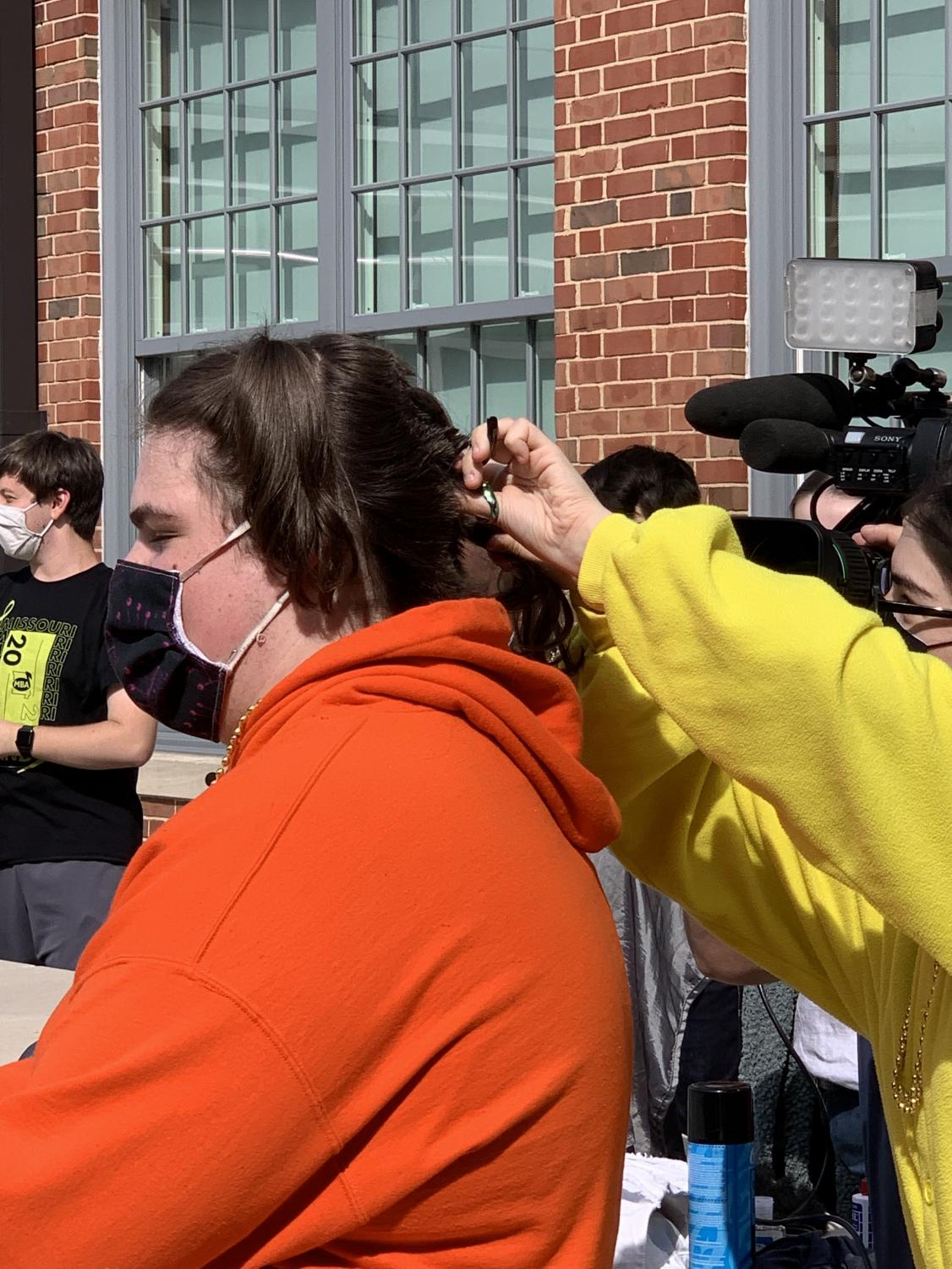 Just a Little Off the Top: Dougan Shaves Head in his Sister's Honor