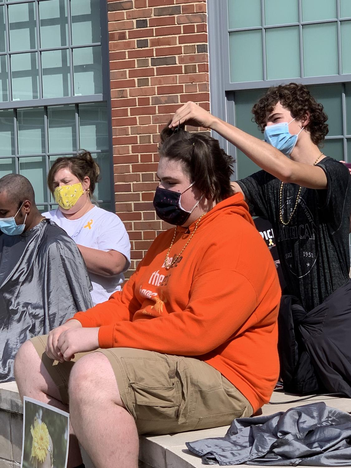 Just a Little Off the Top: Dougan Shaves Head in his Sister's Honor
