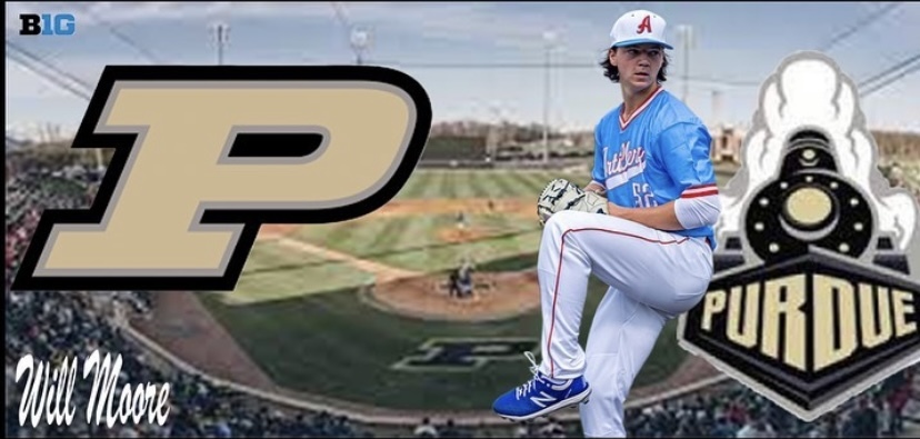 Junior Wille Moore winds up a pitch in front of Purdue's campus and logo. 