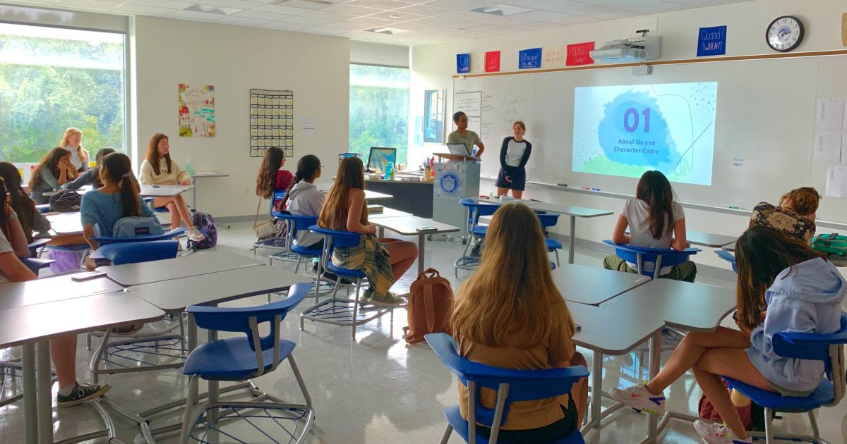 Akhil Nadithe, at the podium, and Annabelle Lang, by the whiteboard, introduce the program to newer members. Nineteen students attended the meeting, the highest turnout in years.
