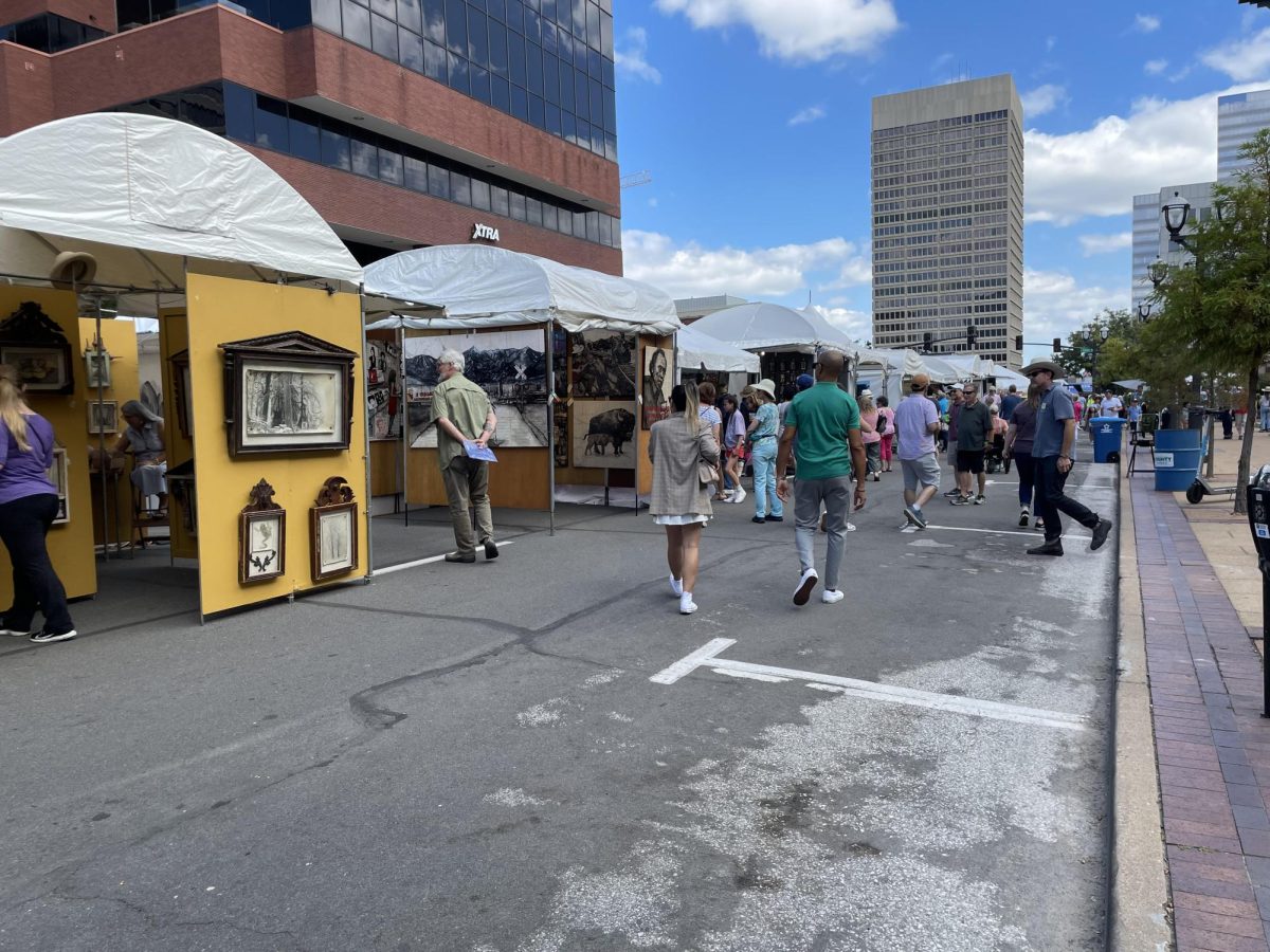 Artists have their work out on display under white canopies as a crowd walks from booth to booth. This year, 156 local artists were handpicked by the fair's juries from approximately 1,115 applicants. “I came to walk around, get some good exercise and just shop around with my family,” sophomore Marah Swillinger said. “We find art fairs so fun to walk around and find art.”