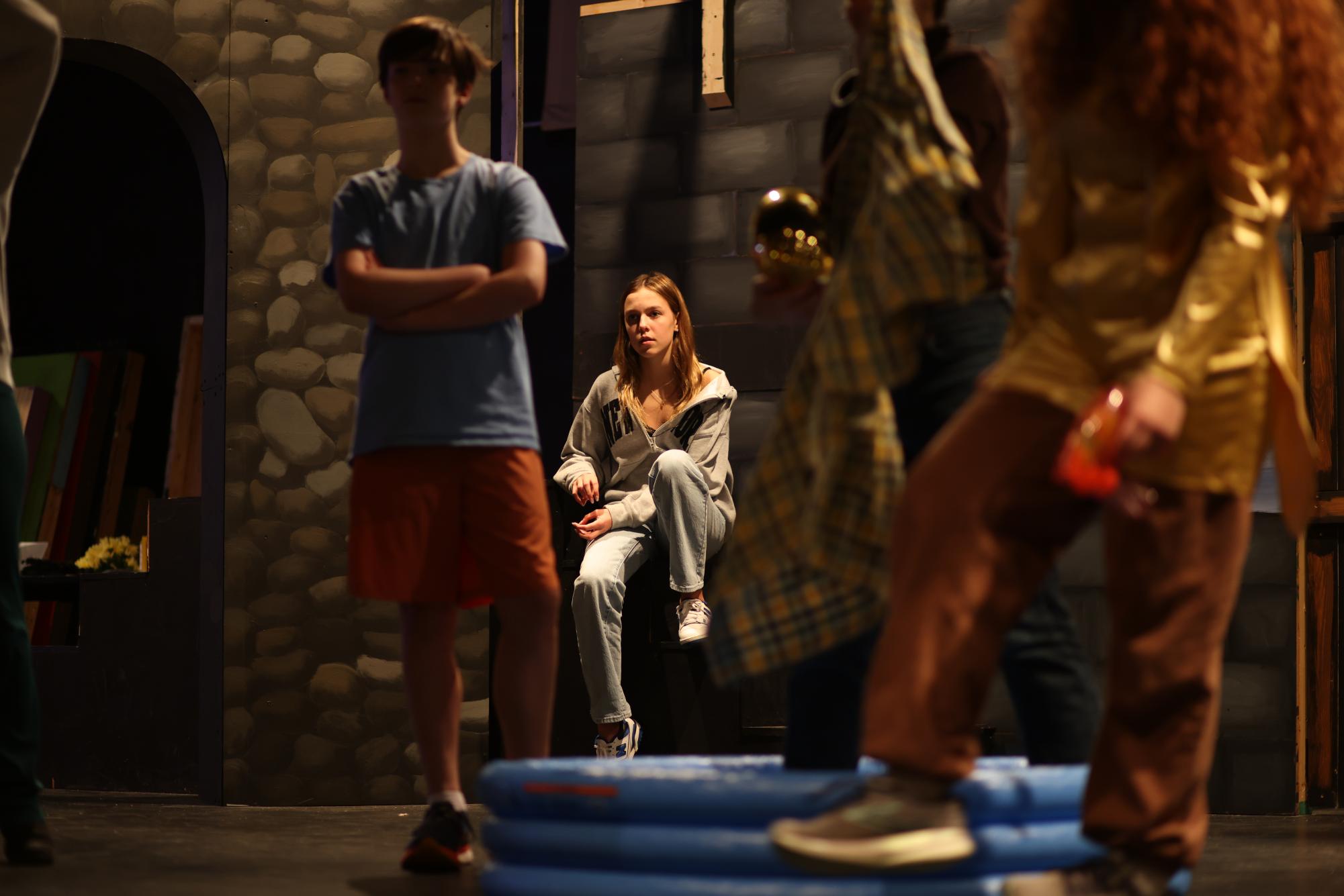 Freshman Amelie Lock rehearses in the high school's Performing Arts Center. She has acted in various environments, from massive open-air theaters like the Muny, to competitive audition rooms in New York City, to her own bedroom on tape for send-in auditions. No matter the environment, she strove to perform at her best—to treat acting as the art form that it is instead of a job in an industry. "There were are a lot of auditions that I'm super proud of, and I think that any actor that you'll talk to will say the same thing because so often we get really close to a role," Lock said. "I think that any actor that you'll talk to will say the same thing. Tens of thousands of people submit for every single call that we get, so there are so many auditions that I'm proud of my performance for, even if I don't get the role."