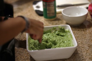 Junior Alexandra Tsygankov mashes up avocados for her moms famous guacamole recipe. Tsygankov mixed up the ingredients in order to make the guacamole, with a recipe she has been using for years. "It's my mothers recipe, I've been making it since I was little," Tsygankov said.