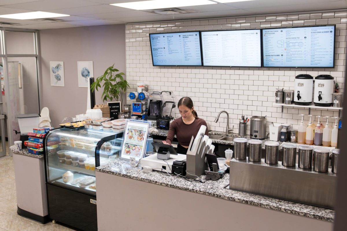 Anna Dalton (12) shakes a milk tea order. After working at Share Sweet for over a year, Dalton has familiarized herself with the menu. “I have most of the recipes and the prices memorized by now because it’s been a while,” Dalton said.