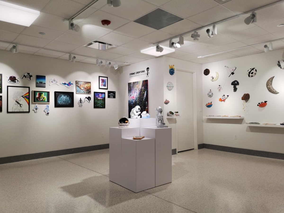 Student artwork is displayed in the Spirtas Gallery as a part of the new exhibition, “Cosmic Creations: Artists Explore the Cosmos.” During the big renovation in 2018, Raedeke requested for a student gallery to be built in a place that is centrally located within the school. “It thought it would be a great opportunity for students to showcase their work so that everybody could see it,” Raedeke said. “It wasn't just tucked away in some corner [that] nobody goes in.”
