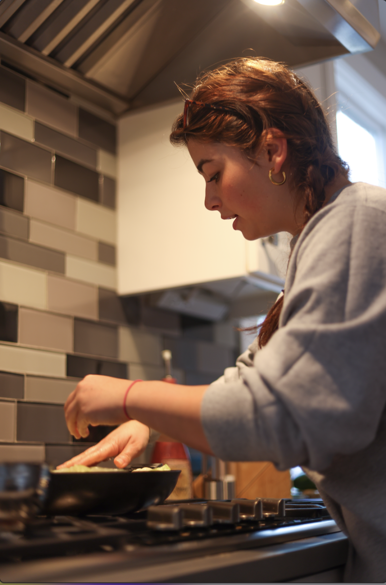 Sophia Anton (10) inspects a cabbage roll. Her recipe was inspired by her mom who died in 2018. “I feel connected to her [when I cook]. I can feel her presence,” Sophia said. 