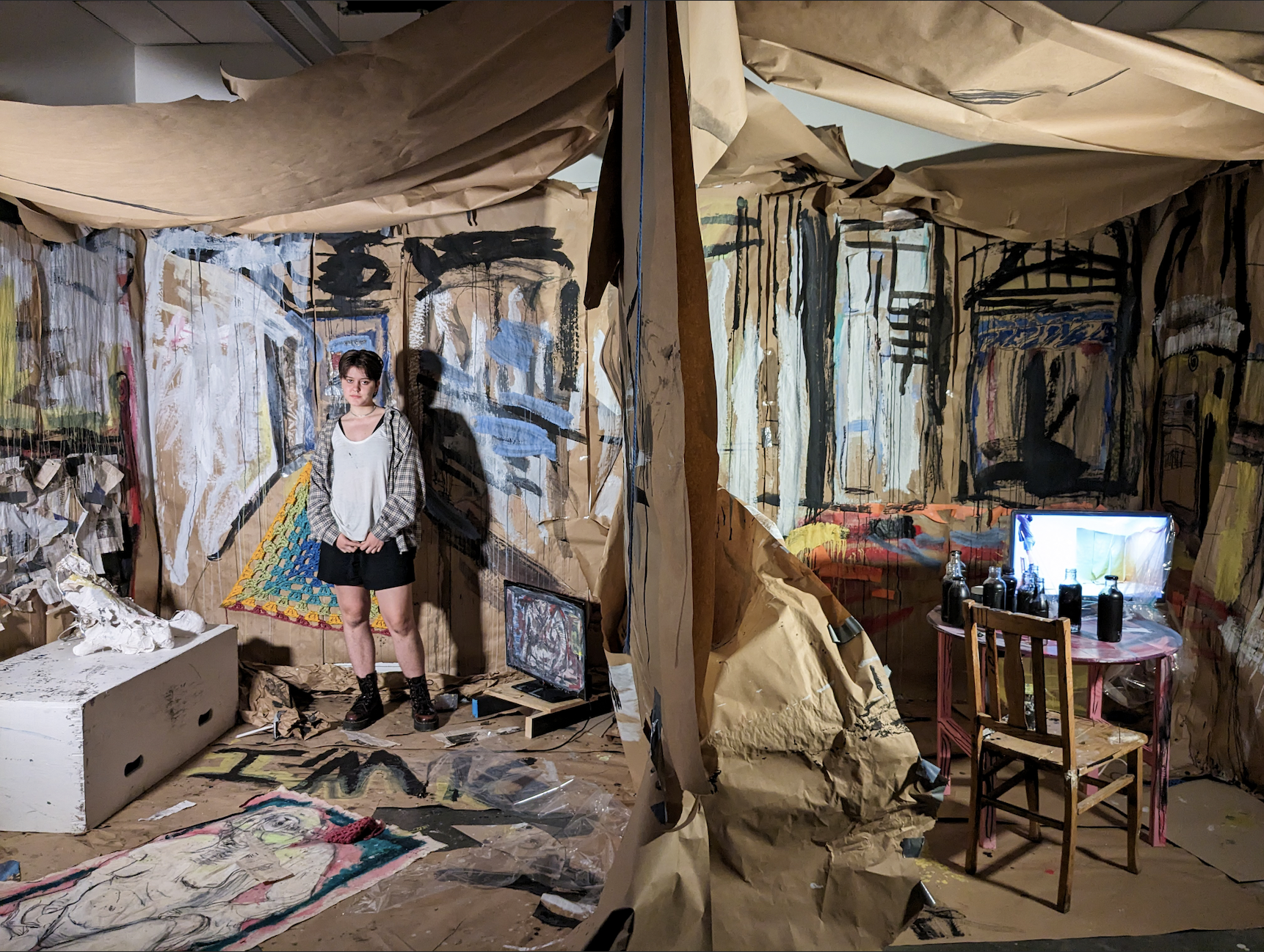 Gray Baker stands in front of her Chicago art installation for the SAIC titled, “This is Not Supposed to be a Representation of my Home.” For hours upon hours, she painted, sketched, sculpted and crocheted all of the pieces that became the final product. “Once I was finished with that installation, I remember sitting down and my whole body being exhausted,” Baker said. “It was very mentally taxing to be in that type of creative mindset that intensely, while also being a quite physically demanding process.”