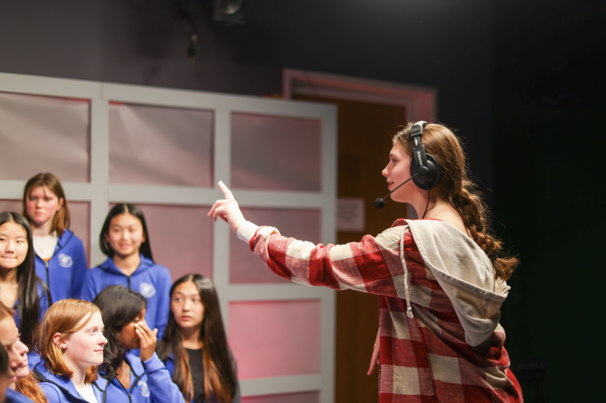Senior Lizzie Esther works in Ladue's film studio developing her film Nov. 20. Lizzie fell in love with the exploratory part of videography: telling people's stories. "[I like to] learn about different perspectives, stories and learn empathy for the world around you," Lizzie said.