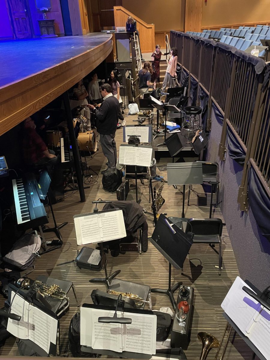 Student actors and musicians conversed during their 10 minute intermission. They spent 40 minutes running the first act of the show. “My favorite part is definitely playing good music and hanging out with friends,” Camryn Miller (12) said. “Also, the snacks.”
