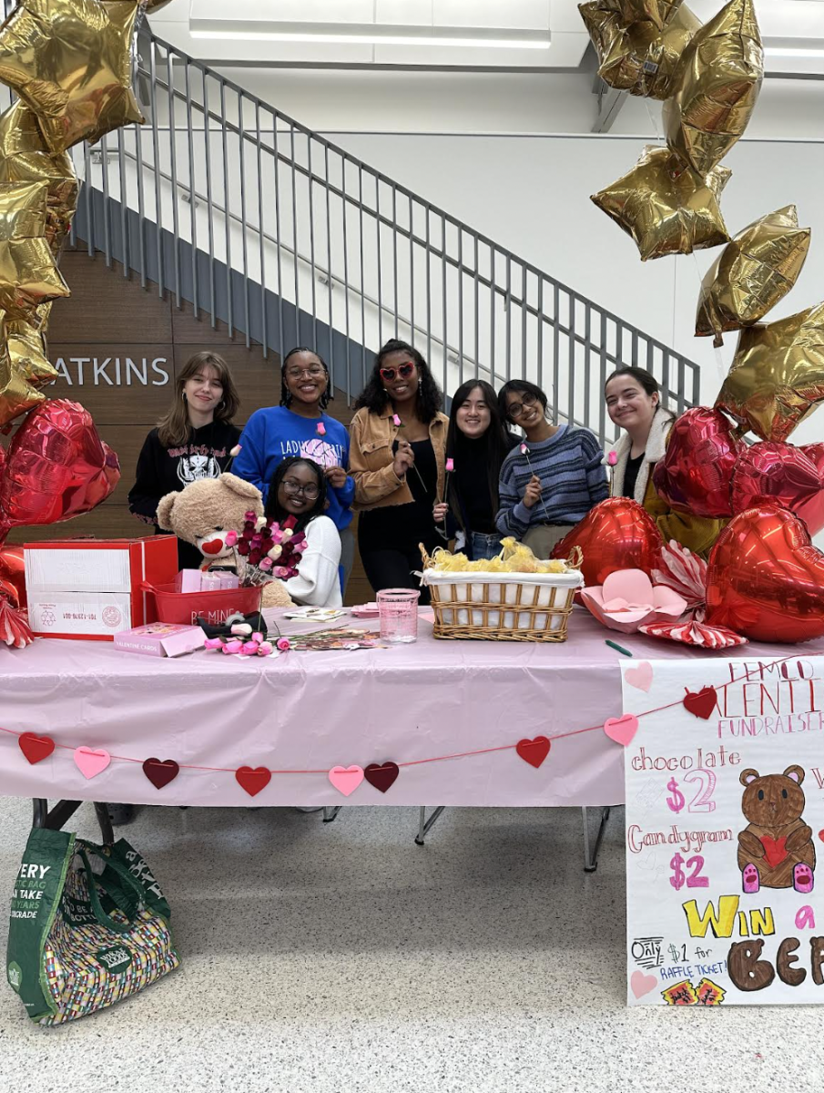 FemCo poses for a picture at their fundraiser table Feb. 12. The club had been selling gifts during the lunches leading up to Valentines Day to raise money. “FemCo is an intersectional feminist club where we focus on feminist discussions on theory and intersectionality," Betlehime Gema (12) said.