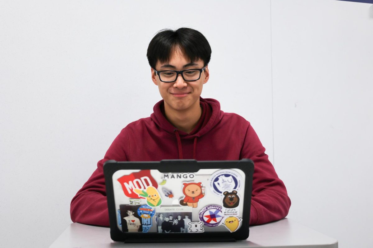 Eric Fan (11) checks his stocks on the
stock market game. This is a common ritual. “I started the game in sixth grade with my brothers,” Fan said.