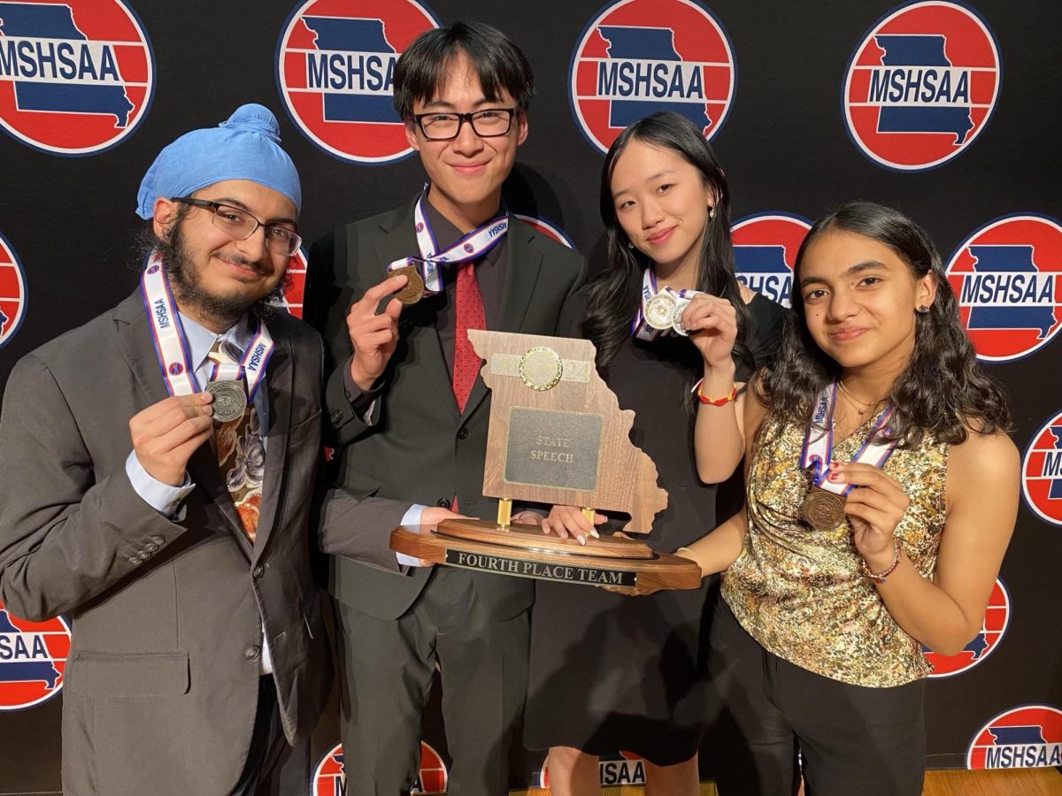 Debate team members pose together holding their medals. Each of the four juniors contributed to their overall fourth-place finish in state speech. “Every [Ladue student] who competed in speech made the podium," Bohan Pan  (11) said.