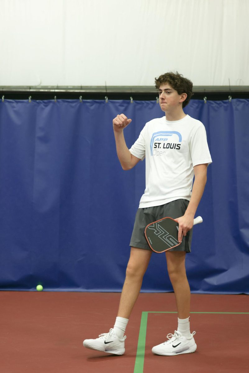 Sawyer Bland (12) celebrates a point after a hard rally. He played against one of his friends in a practice game. "Pickle ball is great," Bland said. "Anyone can play against almost anyone regardless of their skill level and have a decent game."