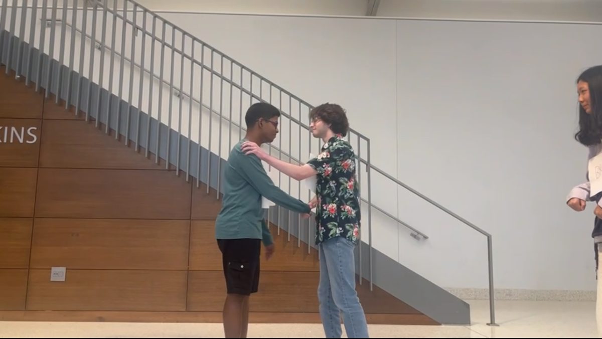Chanuth Dulain Batagoda Nahallage Don and Levi Blair shake hands as they play the roles of Montcalm and General Wolfe, respectively. Riley Keltner's W4 class acted out the Battle of Quebec and General Wolfe's death last Friday, Sept. 12 in the multipurpose room. 