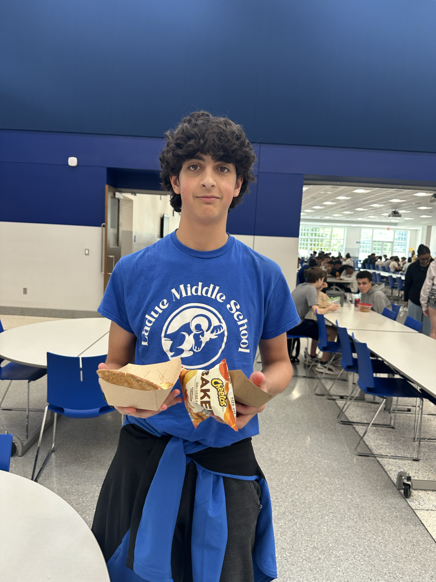 "I have a pepperoni and sausage pizza, baked Cheetos, and carrots.” swimmer Henry Grossman (9) said.