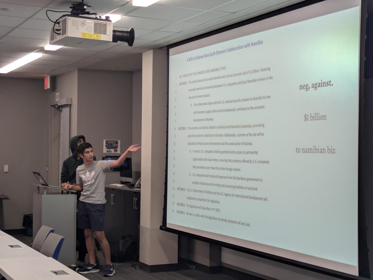 Urmil Patel (12) and Liam Shoghi (11) deliver their congressional debate presentation.