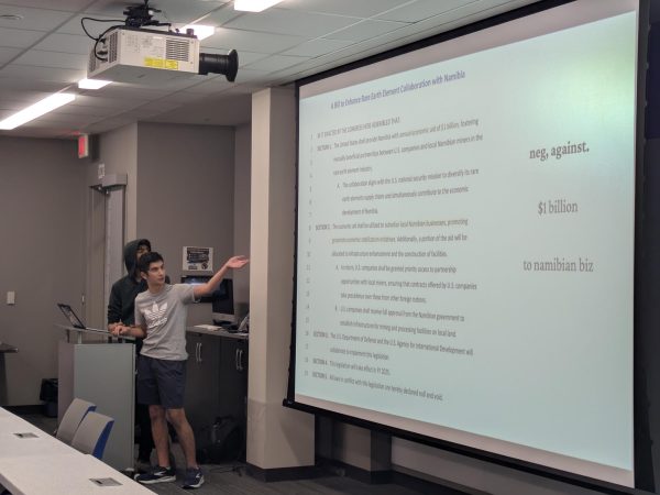 Urmil Patel (12) and Liam Shoghi (11) deliver their congressional debate presentation.