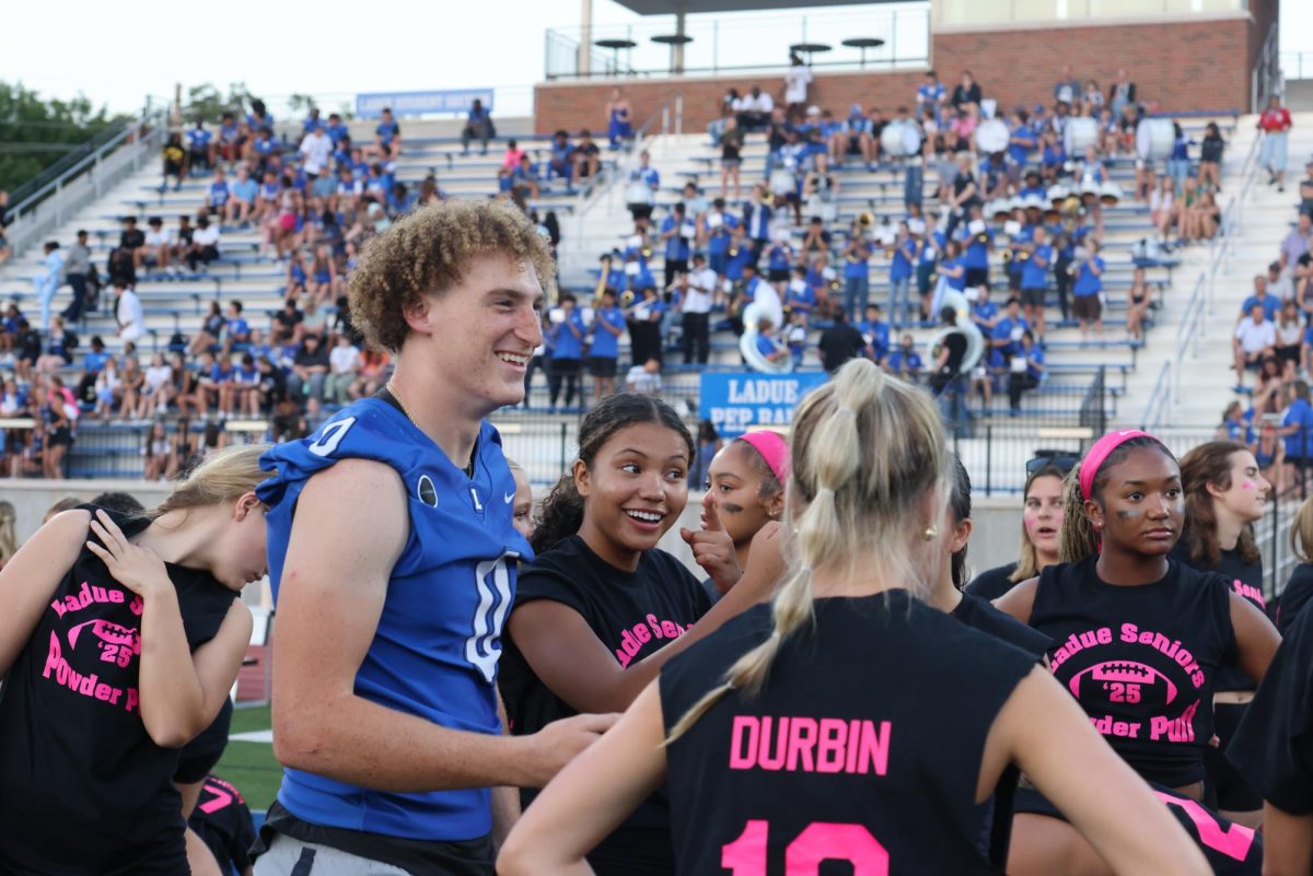 Seniors and juniors play against each other at the yearly Powderpuff game Sept. 29. The seniors won 24-0. "It was a good win for the seniors and I'm happy everyone performed well," Sophie Miller (12) said.