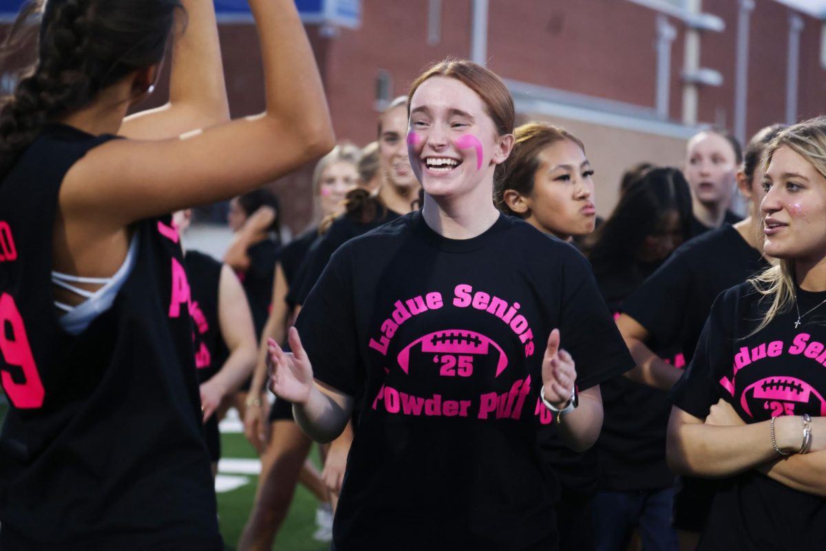 Seniors and juniors play against each other at the yearly Powderpuff game Sept. 29. The seniors won 24-0. "It was a good win for the seniors and I'm happy everyone performed well," Sophie Miller (12) said.