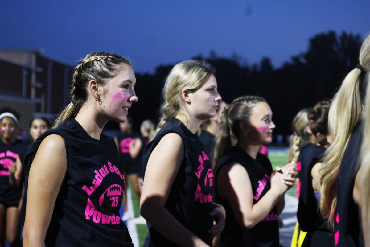 Seniors and juniors play against each other at the yearly Powderpuff game Sept. 29. The seniors won 24-0. "It was a good win for the seniors and I'm happy everyone performed well," Sophie Miller (12) said.