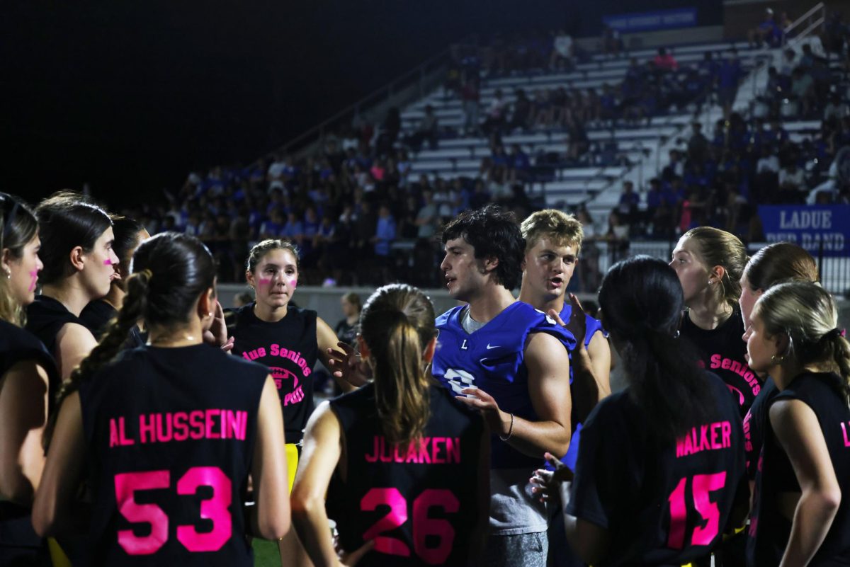 Seniors and juniors play against each other at the yearly Powderpuff game Sept. 29. The seniors won 24-0. "It was a good win for the seniors and I'm happy everyone performed well," Sophie Miller (12) said.