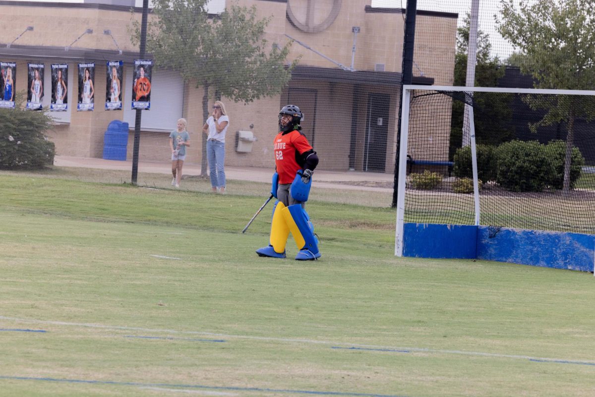 Mimi Tabscott (11) steps out from the goal in Ladue’s game against Westminster. Tabscott blocked all goals in this game, with the final score being 7-0. “I always try to stay in the right mindset and keep my composure at a high level in games,” Tabscott said.