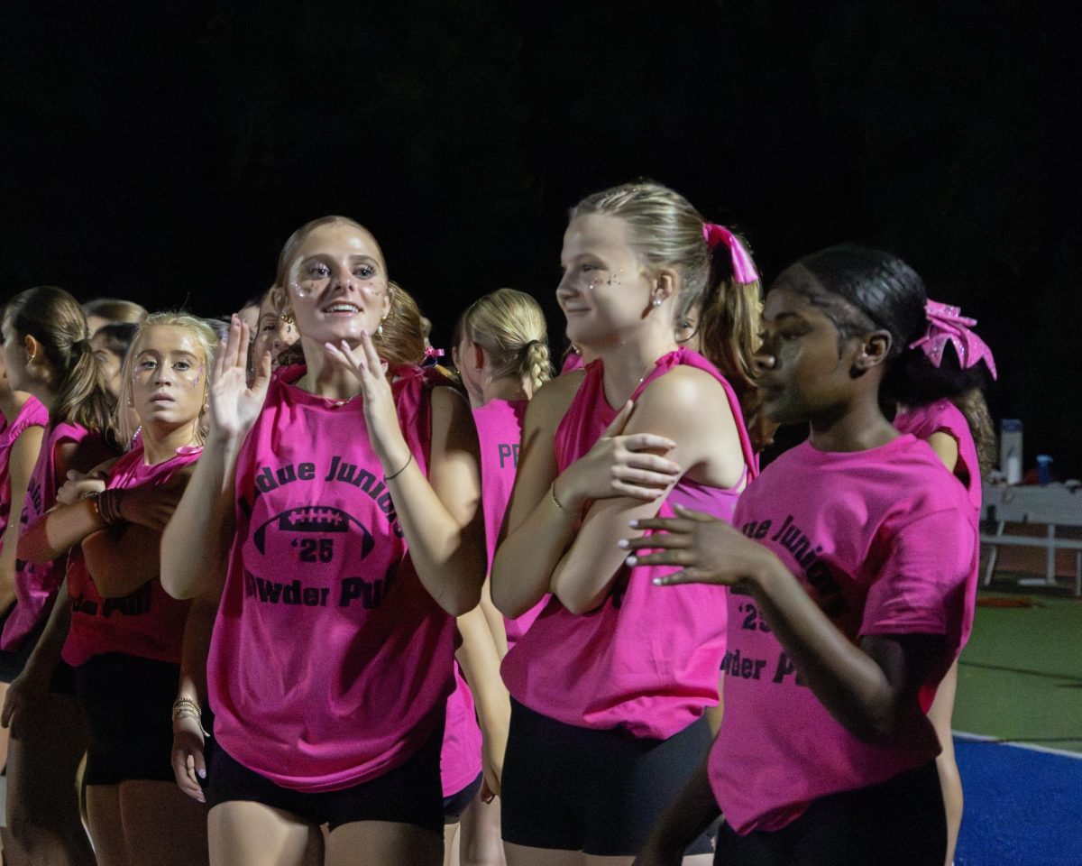 Students and staff gather together as the annual Powderpuff game commences Sept. 29. Seniors came out victorious over the juniors 24-0. "I was just happy to be with my friends," Kira Cornell (12) said. "It was fun and a good way to start homecoming week."