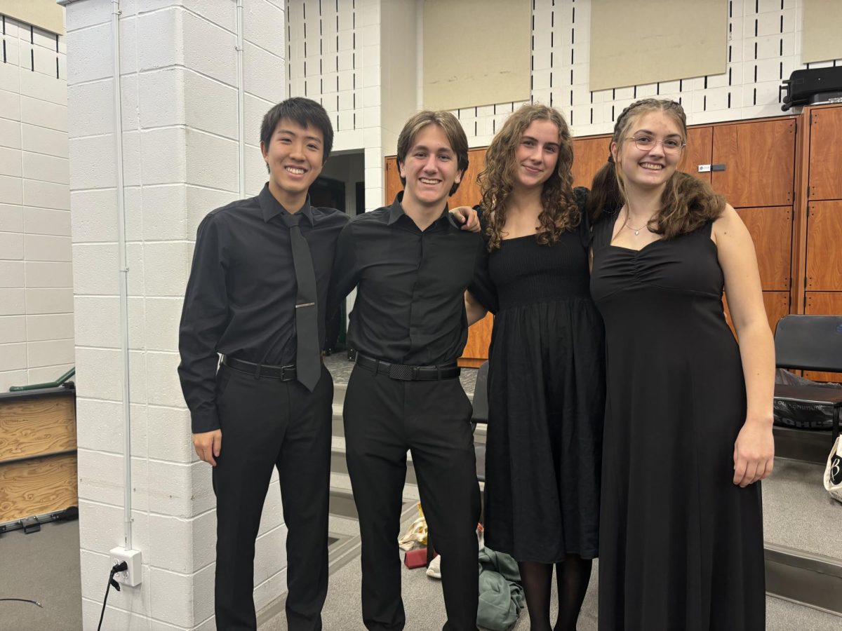 St. Louis All-Suburban Choir Members of the 2024-25 season Anthony Zhao (12), Norah Murphy (12) and graduated members Cooper Mortensen and Natalie Shellhaas stand in the rehearsal room before their concert. Five students made the All-Suburban choir this year. "[Being on All-Suburban] gives me more content, and I definitely have to dedicate at least four or five hours every week outside of school to practice and learn more music," Zhao said. "So it definitely makes music a bigger part of my life."