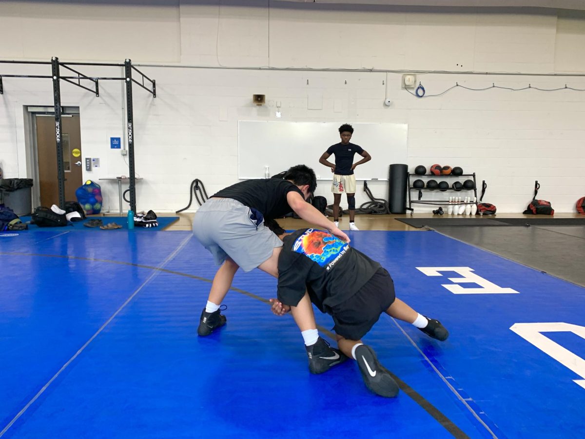 Ladue wrestlers train and grapple at a pre-season practice. Even after workouts were over, many wrestlers stayed late to compete in games like “King of the Mat”. “It's a great opportunity for kids to come in and work with each other before the season begins,” coach Jeff Fiorini said.