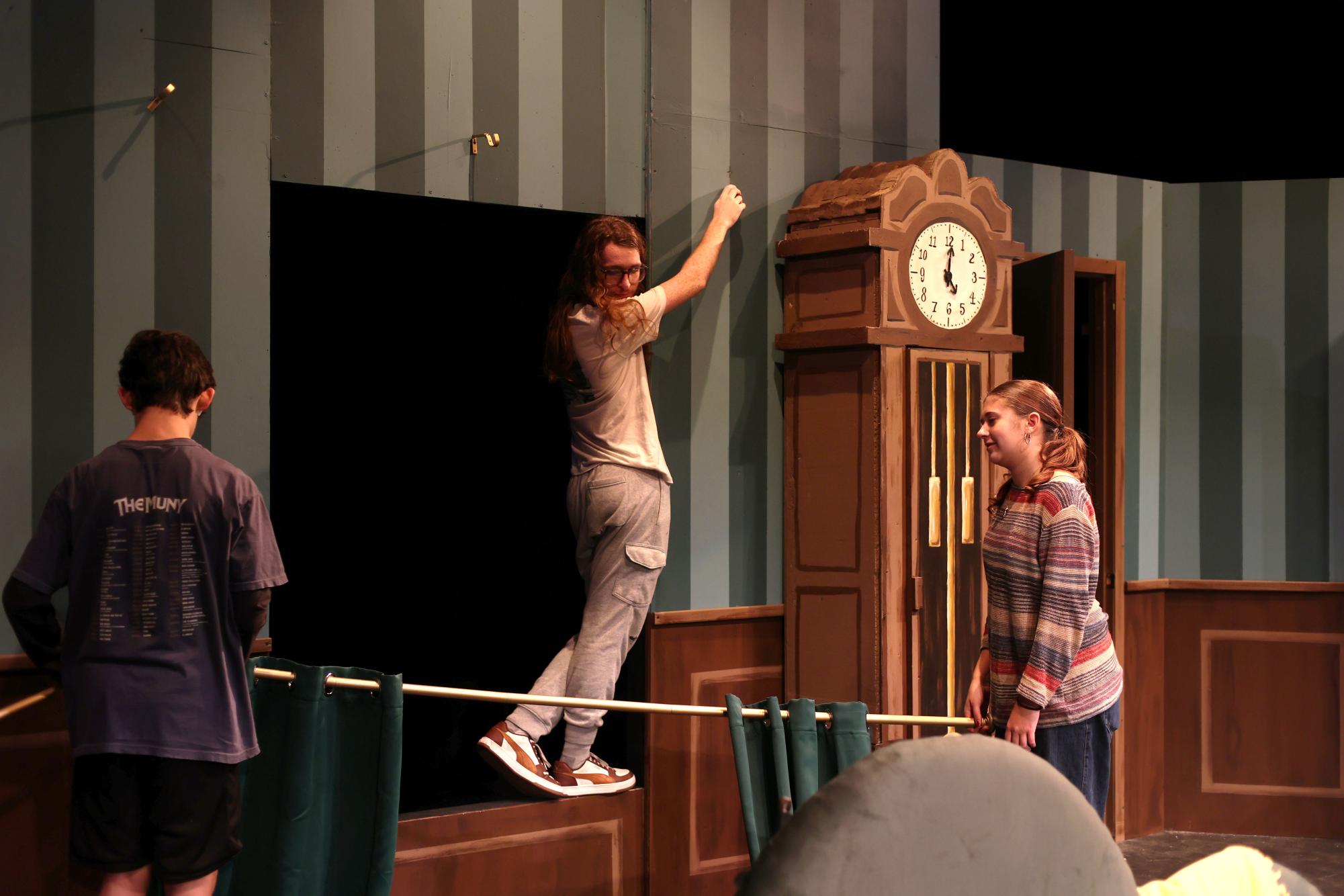 Students set up The Play That Goes Wrong stage Oct. 16