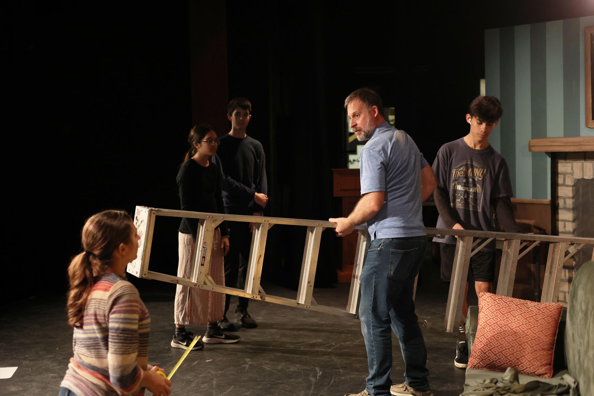 Students set up The Play That Goes Wrong stage Oct. 16