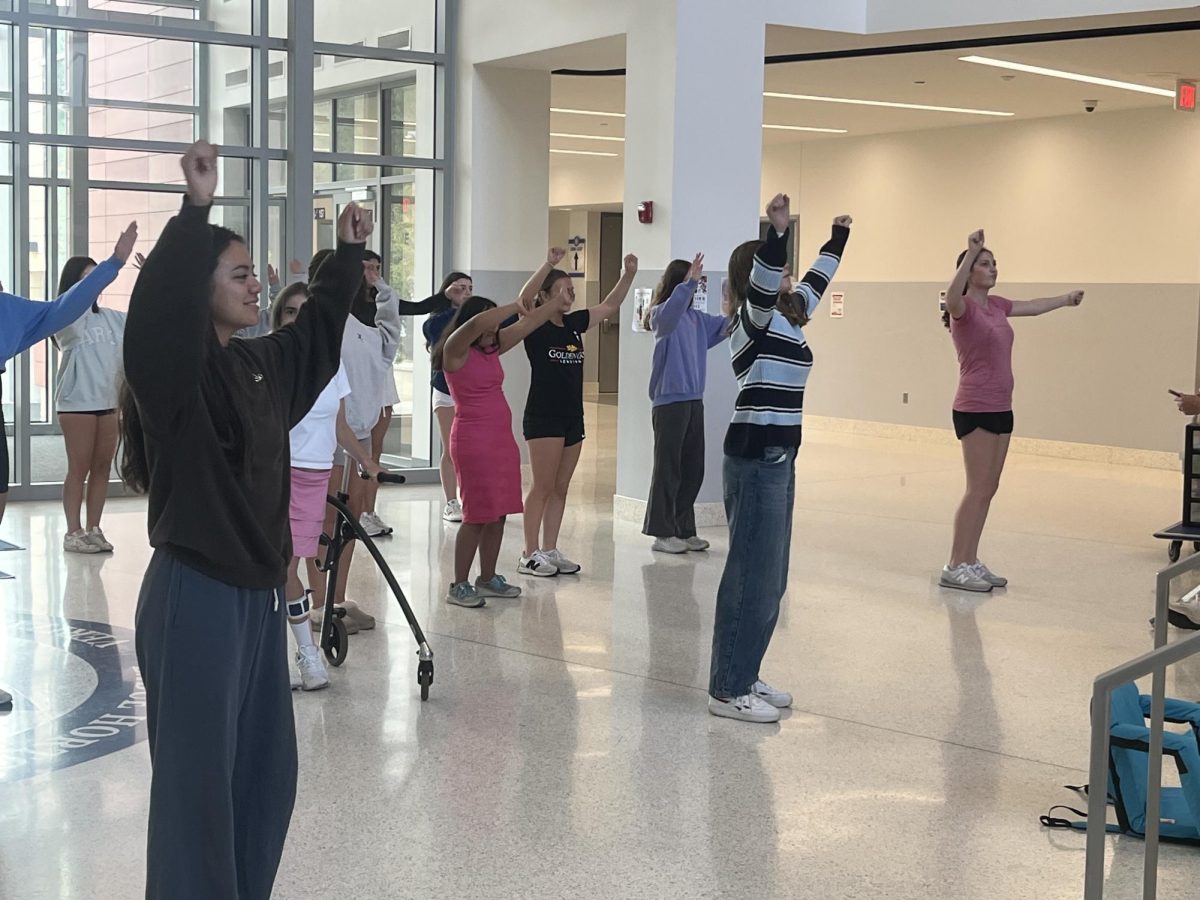 Sparkle members rehearse their dances with co-captains leading in the front. The dance team held their weekly practice Oct. 6 near the student entrance. “My favorite part of practice is [making] crafts,” DeRuisseau said. “It’s a relaxing way to end a Monday and a great start to the rest of the week.”