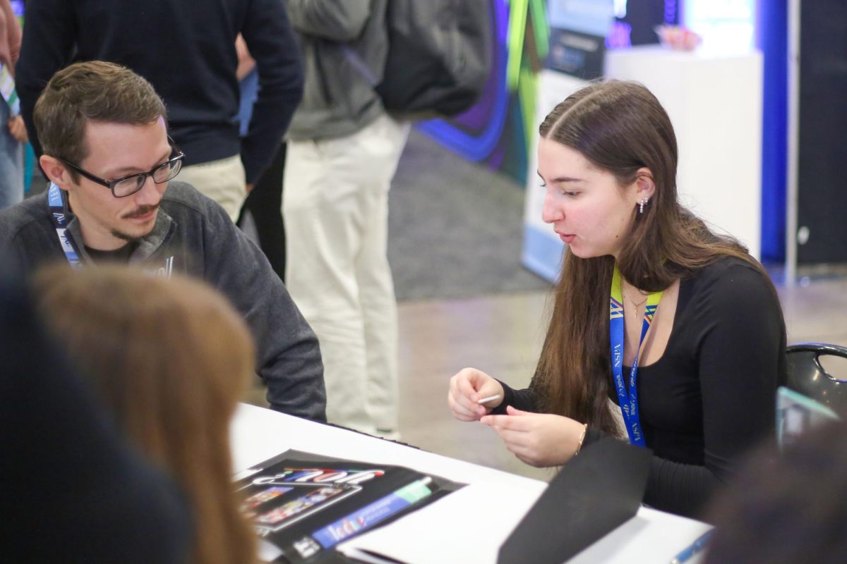 Yearbook editor-in-chief Ivana Todorova meets with a representative from Varsity Yearbooks to discuss the 2026 Rambler. Todorova has spent three years on the yearbook staff. 