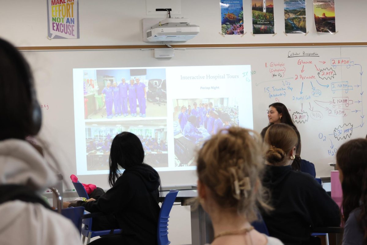 Madeline Awad (12) presents interactive hospital tour opportunities to Bridges to Medicine club members. The club has toured Laboratory, Respiratory Therapy, Radiology, Surgery, Emergency Medicine and Nursing units. “It began as a program to introduce these students to various medical specialties through immersive, hands-on experiences,” Awad said.