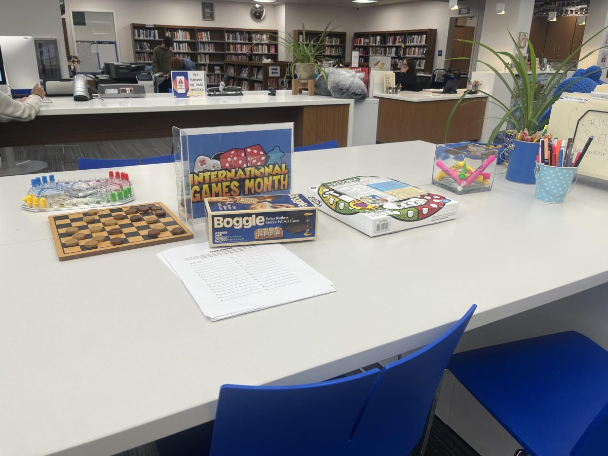 The table in the library is set up with various board games. The goal was for students to celebrate International Game Month with their friends. “[The games] have proven to be fun for friends,” Librarian MaryKate Mortland said.