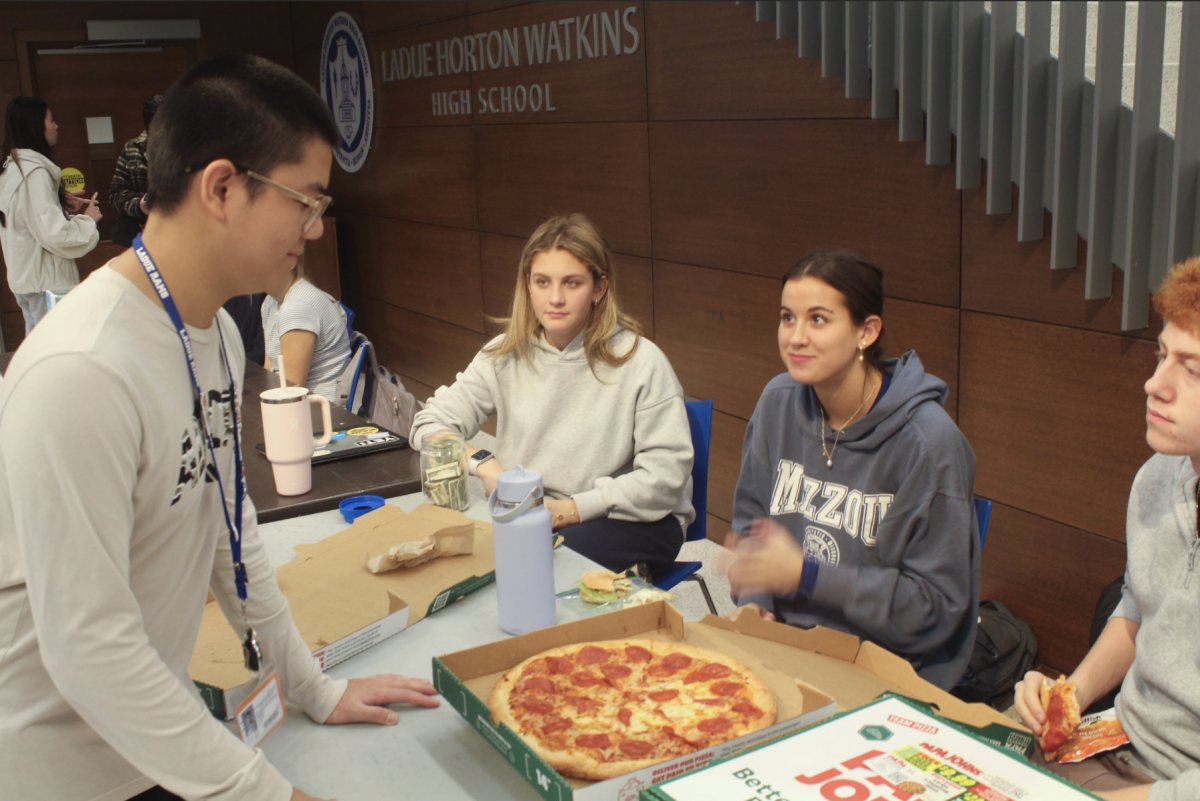 The Dance Marathon executive board members interacted with customers as they sold pizza during a fundraiser Friday, November 21. The Ladue club hosted the pizza sale during all lunch periods. "The pizza fundraiser is usually one of our most successful ones," Berger said. "It is fun for both the board members and students, who get to enjoy good food."