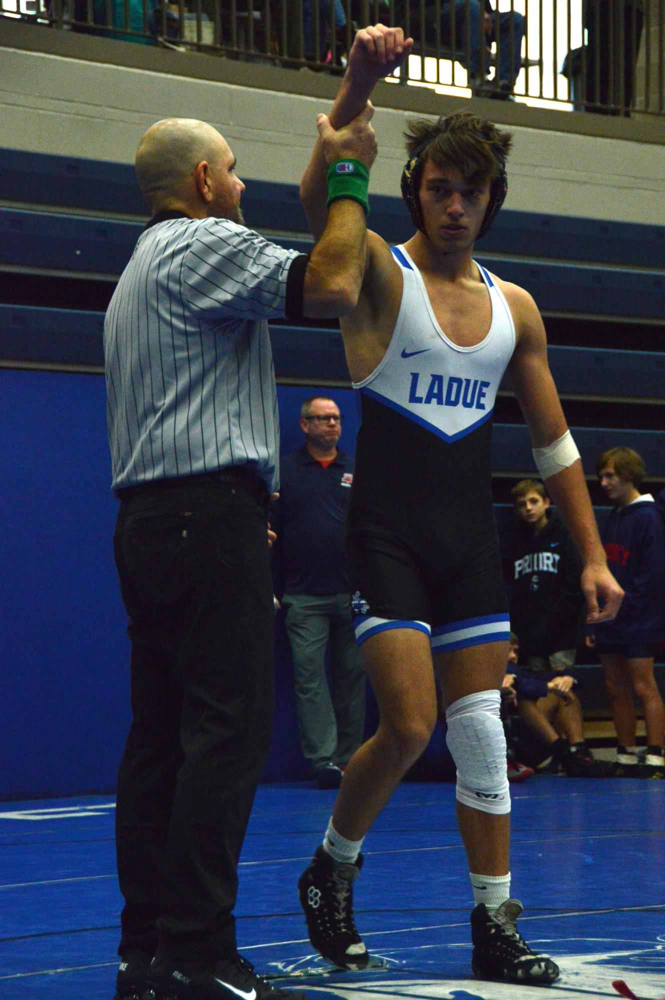 Varsity wrestling brings home trophies from the John Burroughs Tournament Dec. 5-6